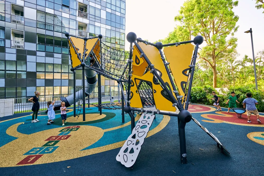 Finished yellow-and-black playground with children playing